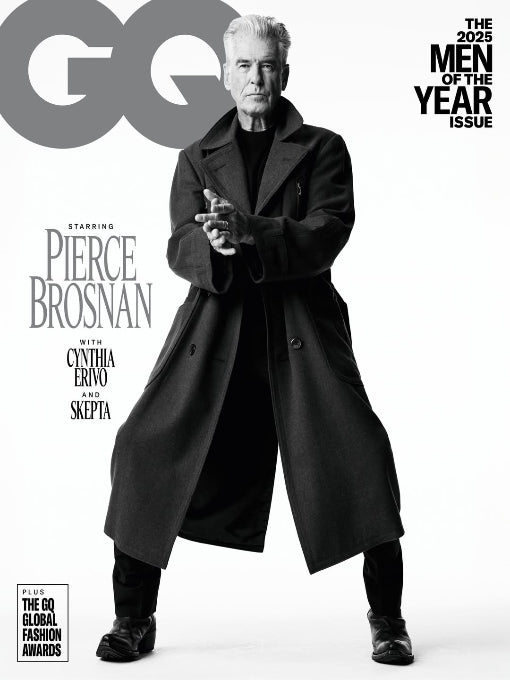 GQ magazine cover featuring Pierce Brosnan with a black coat and white background